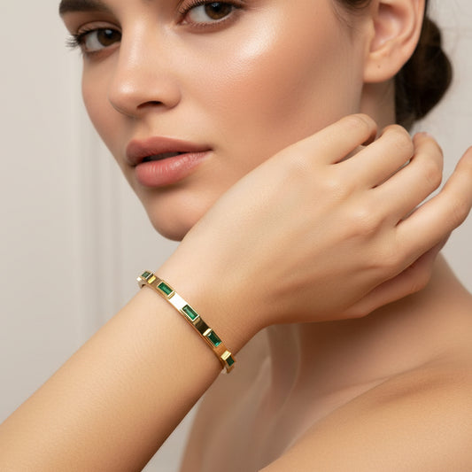 Elegant 18k gold plated green zircon bangle worn on a model's wrist for a stylish look