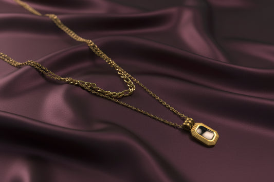 18k gold plated layered necklace featuring a stylish pendant on a silky background