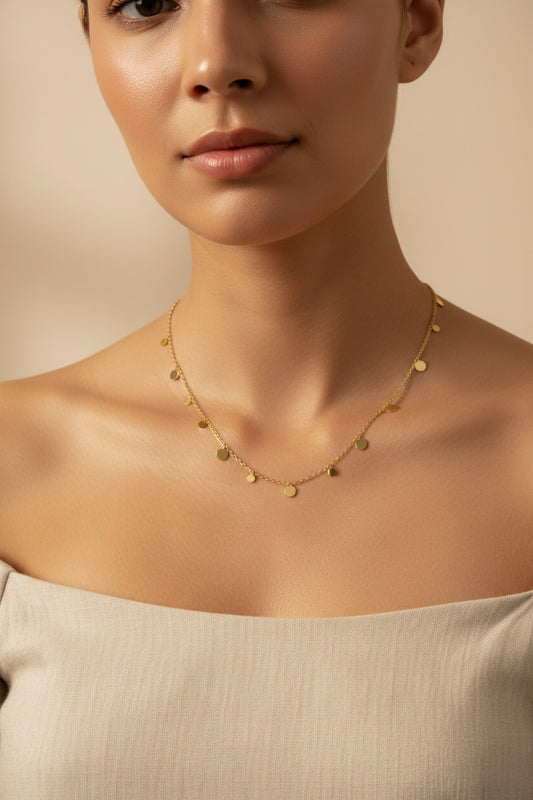 Elegant 18k gold plated stainless steel necklace with delicate disc charms, perfect for everyday wear