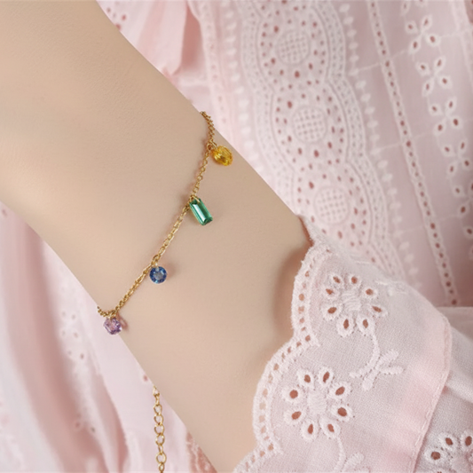 Stylish gold plated gemstone bracelet featuring vibrant multi-coloured gemstones on a delicate chain