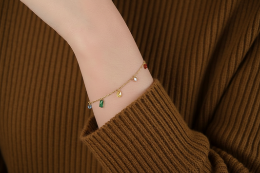 Gold plated gemstone bracelet with various colourful gemstones on a delicate chain