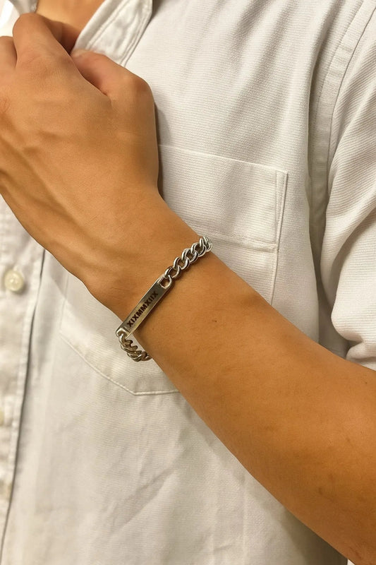 Stylish silver bar bracelet from Lustre of Love worn on a man's wrist, featuring a modern design