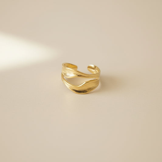 Lustre of Love Gold Wave Ring in a unique design, featuring stainless steel adjustable size for versatility