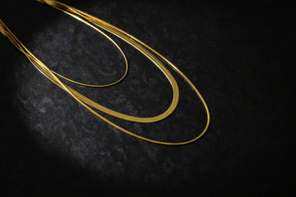 18k gold plated layered snake chain necklace with elegant, smooth texture and shiny finish