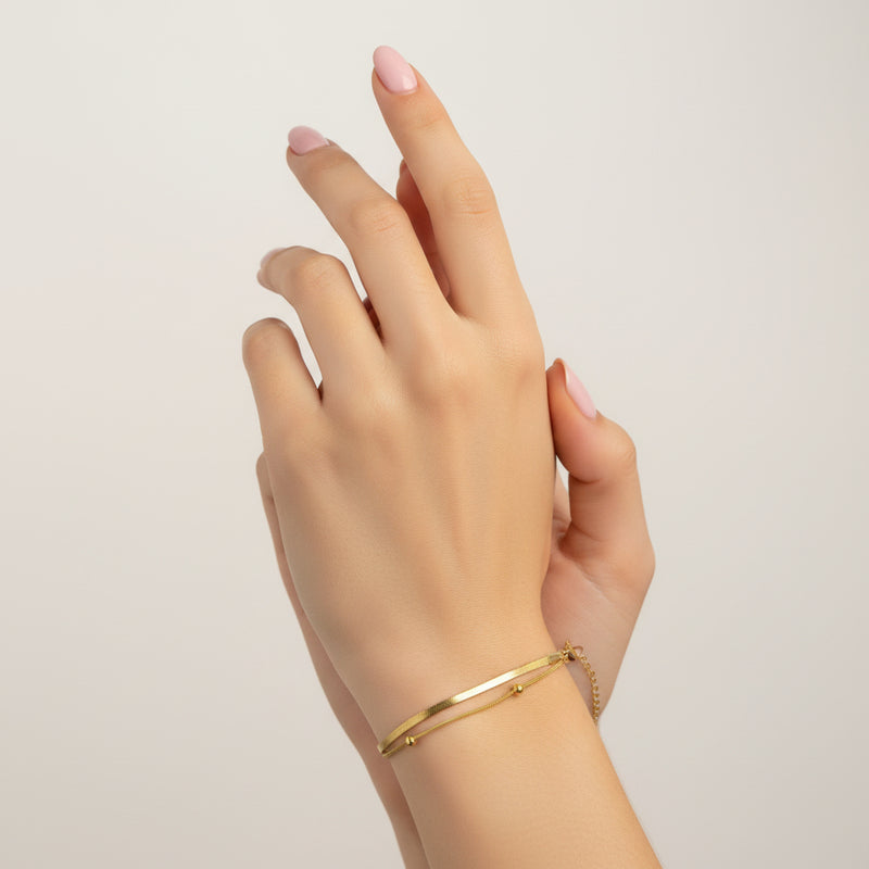 Elegant 18k gold plated snake chain bracelet worn on a model's wrist, perfect for daily wear
