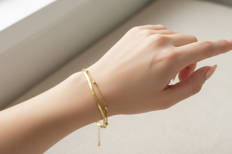 Elegant 18k gold plated snake chain bracelet worn on a wrist for a stylish look