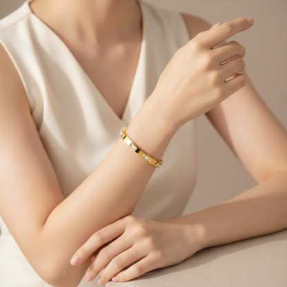 Elegant 18k gold plated stainless steel bangle displayed on a wrist for a stylish accessory look