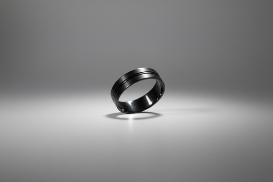 Black stainless steel ring with a sleek, modern design featuring two horizontal grooves