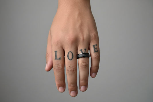 Lustre of Love black stainless steel ring worn on hand with love tattoo