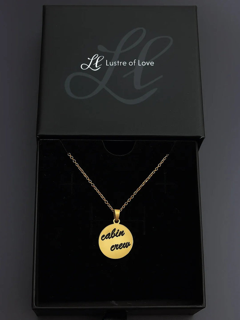 Gold custom round pendant necklace from Lustre of Love with engraved 'cabin crew' design