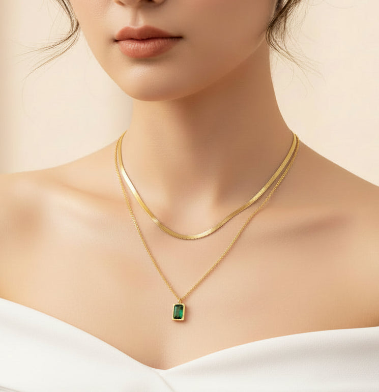 Emerald layered necklace gold plated worn elegantly with two delicate gold chains