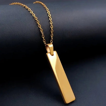 Lustre of Love sleek gold bar pendant on a delicate gold chain necklace