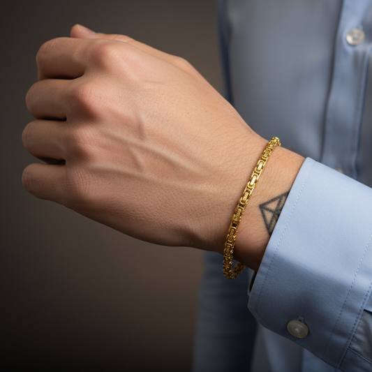 Gold Byzantine Link Chain Bracelet worn on a man's wrist, showcasing elegant design and shine