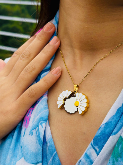 Lustre of Love custom daisy pendant with gold chain worn on neck with hand near collarbone