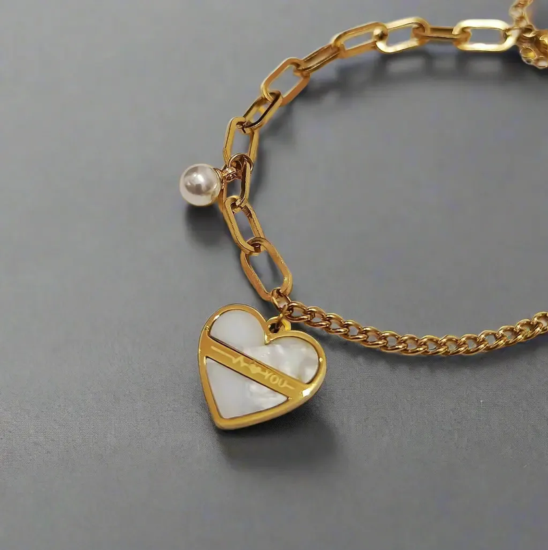 Lustre of Love gold chain heart charm bracelet with pearl detail and white enamel heart pendant