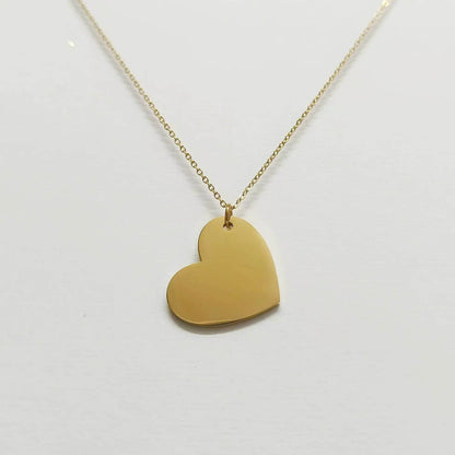 Lustre of Love gold heart pendant necklace with smooth polished surface on delicate chain