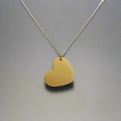 gold heart pendant necklace with smooth polished surface on delicate chain