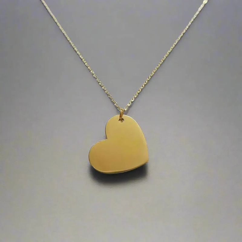 gold heart pendant necklace with smooth polished surface on delicate chain