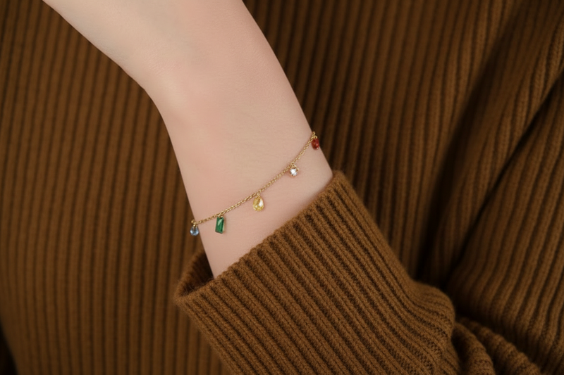 Gold plated gemstone bracelet with various colourful gemstones on a delicate chain