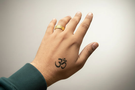 Gold stainless steel ring for men worn on hand with a unique tattoo design