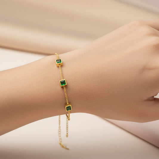 Elegant green zircon bracelet gold plated featuring three sparkling stones on a delicate chain