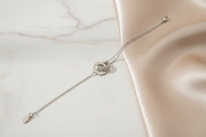 Lustre of Love interlocking circles bracelet stainless steel on a soft satin background