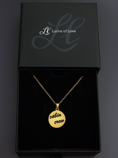 Gold custom round pendant engraved with cabin crew text in a Lustre of Love black gift box