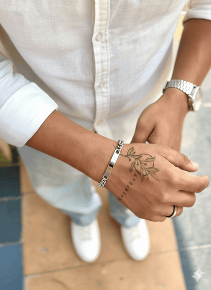 Stylish silver bar bracelet worn on wrist, showcasing modern design and casual fashion