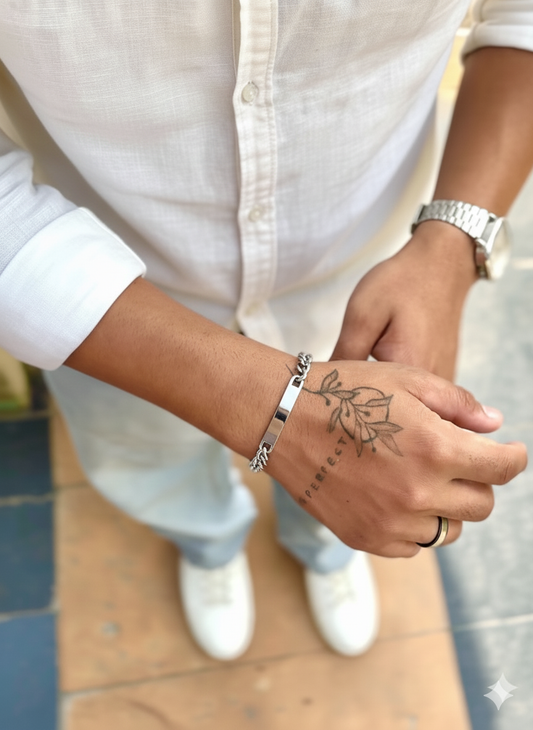 Stylish silver bar bracelet worn on wrist, showcasing modern design and casual fashion