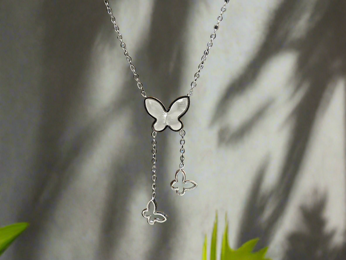 Lustre of Love silver butterfly pendant necklace with dangling butterfly charms on delicate chain
