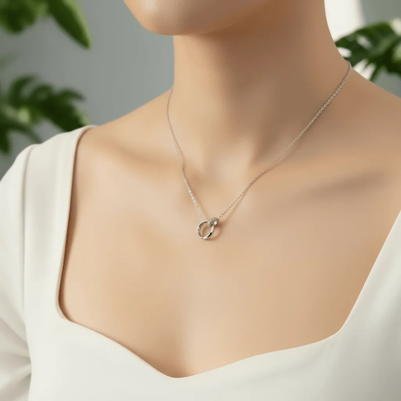 Lustre of Love silver interlocked ring pendant necklace with delicate chain in soft natural light