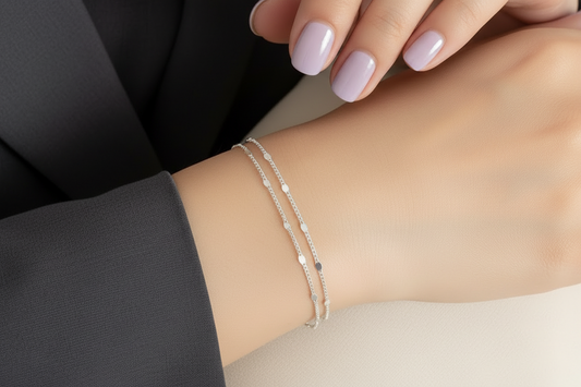 Elegant silver Korean double layer bracelet worn on a woman's wrist, showcased with soft lighting