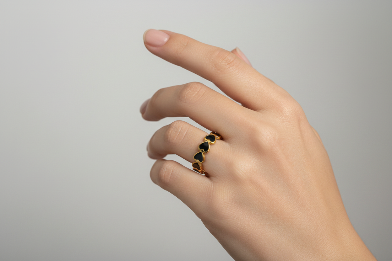 Lustre of Love ring featuring heart-shaped design in gold with stainless steel adjustable size