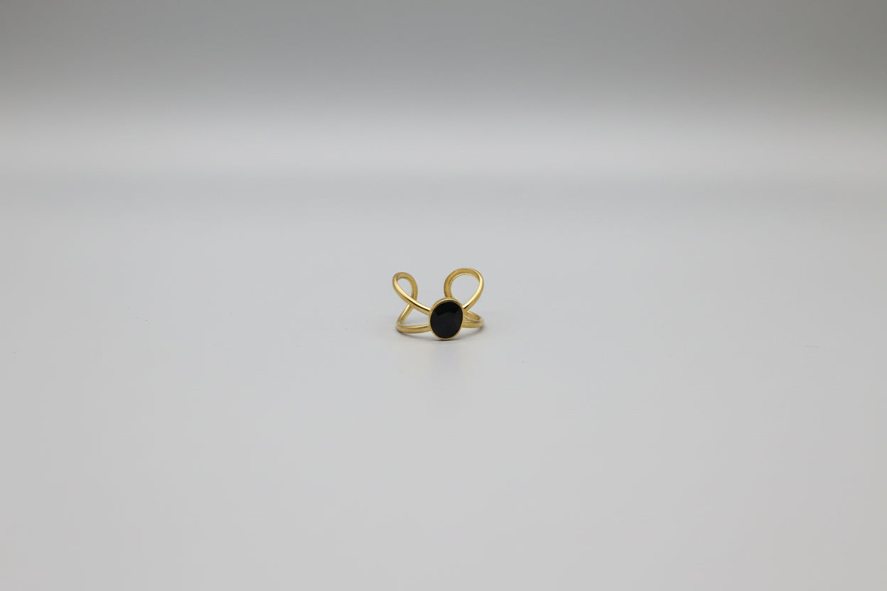 Elegant Lustre of Love gold ring featuring a black stone and stainless steel adjustable size design