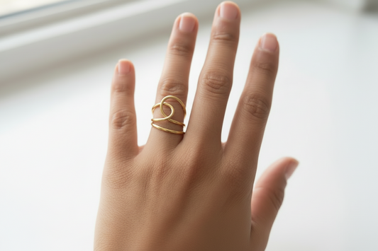 Gold Lustre of Love ring on a hand featuring a unique design with stainless steel adjustable size