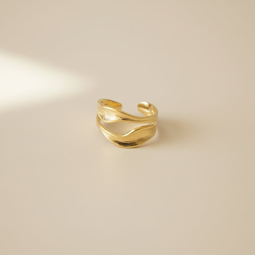 Lustre of Love Gold Wave Ring in a unique design, featuring stainless steel adjustable size for versatility