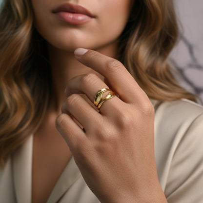 Lustre of Love gold ring on model's hand showcasing a stainless steel adjustable size feature