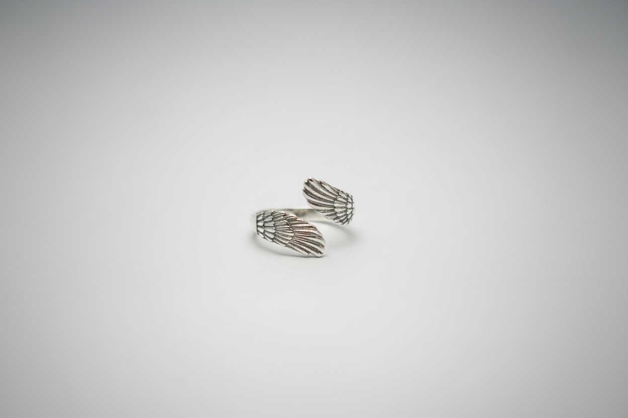 Lustre of Love stylish ring with intricate wing design, made from stainless steel adjustable size